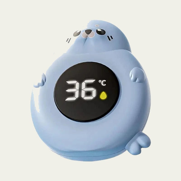 Seal-shaped baby bath thermometer showing 36 degrees
